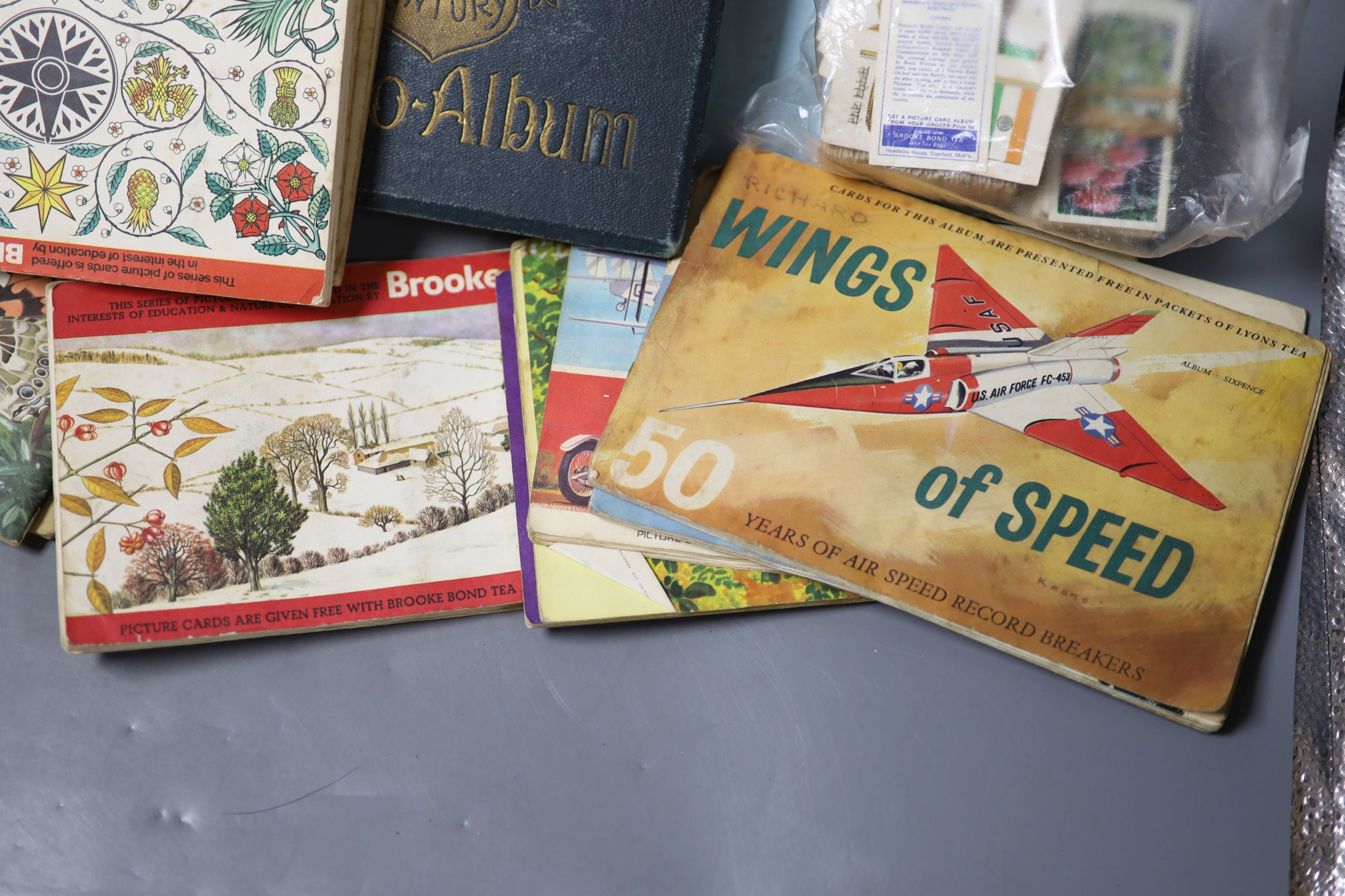 A collection of postcards, cigarette cards, etc.